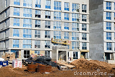 Mineral wool for insulation of the facade building. Insulation for thermal protection to the shell of the house. Suspended cradle/ Stock Photo