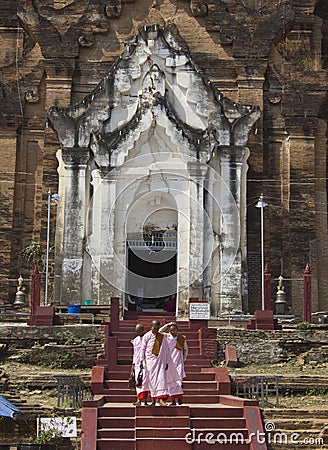 The Mingun Pahtodawgyi and girl monks Editorial Stock Photo