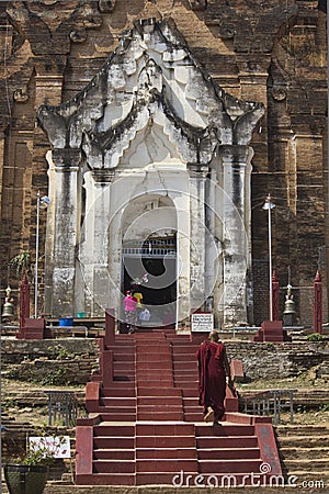 The Mingun Pahtodawgyi and a monk Editorial Stock Photo