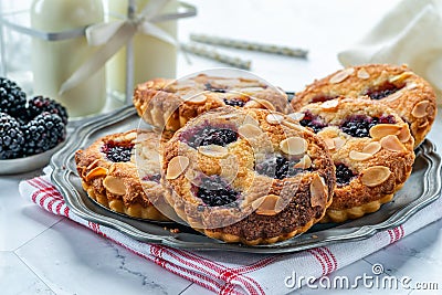 Mini blackberry bakewell tarts Stock Photo