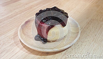Mini Blueberry New York Cheesecake on Wooden Plate Stock Photo