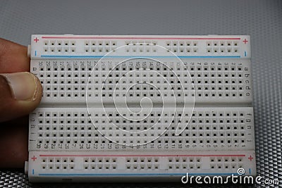 Mini breadboard which is used for prototyping various electronic projects. Circuit experiment solderless breadboard Stock Photo