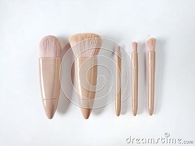 Mini brown makeup brush for facial makeup Stock Photo