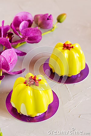 Mini cakes with yellow glaze Stock Photo