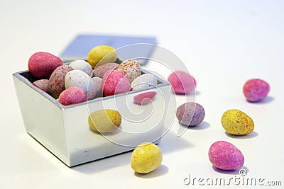 Mini candy chocolate eggs in a polished silver box Stock Photo