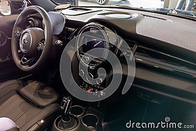 Mini car dashboard detail black interior and modern steering wheels design of sport Editorial Stock Photo