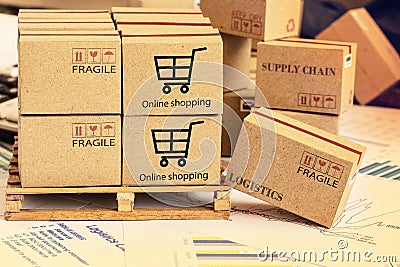 Mini cardboard boxes grouping of financial investment products on wood pallet. Ideas for assembling a portfolio of assets which Stock Photo