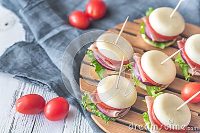 Mini cheese and prosciutto sandwiches Stock Photo