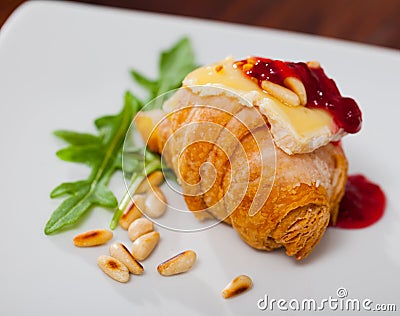 Mini croissant with camembert, jam, pine nuts Stock Photo