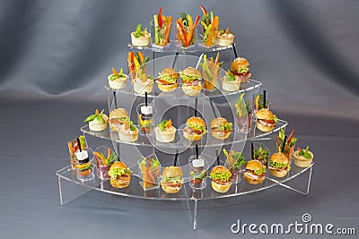 Mini desserts and meat canapes vegetable snacks Stock Photo