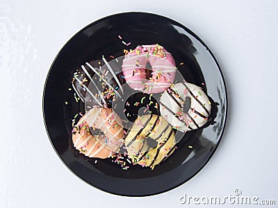 Mini donuts with colorful sugar topping Stock Photo