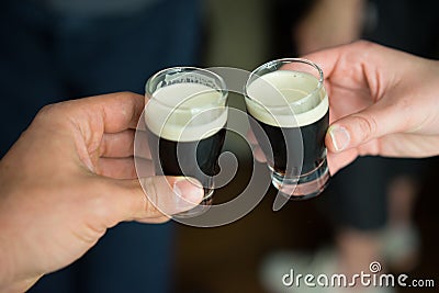 Mini guiness beer cheers Stock Photo