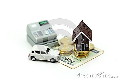 Mini House with stack of coins and car,Saving and investing money concept, Future financial planning concept. Stock Photo