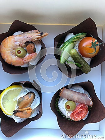 mini-pancakes with meat, shrimp, vegetables in white box Stock Photo