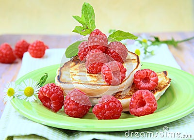 Mini pancakes with ripe fresh raspberries Stock Photo