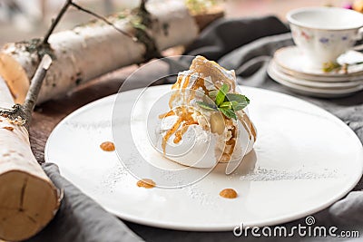 Mini Pavlova Meringue Dessert with Yellow Fruit Stock Photo