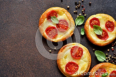 Mini pie with tomatoes and cheese. Quiche with vegetables Stock Photo