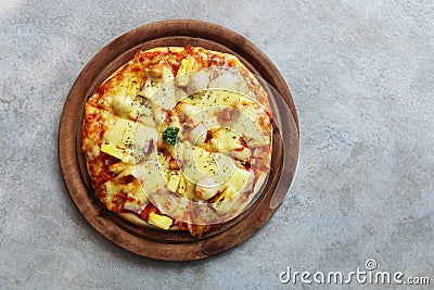 mini pizza on wooden plate Stock Photo