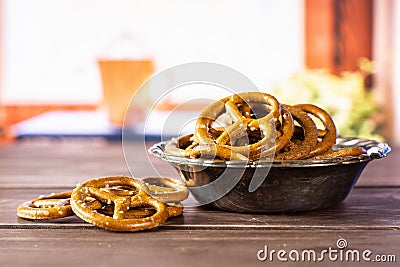 Mini salted pretzels with books on window Stock Photo