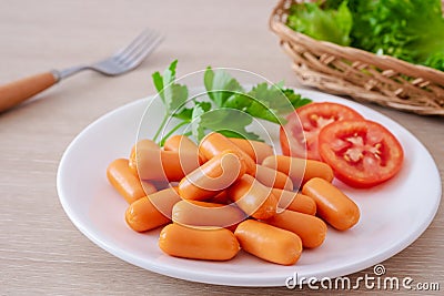Mini sausage and vegetable on white plate Stock Photo