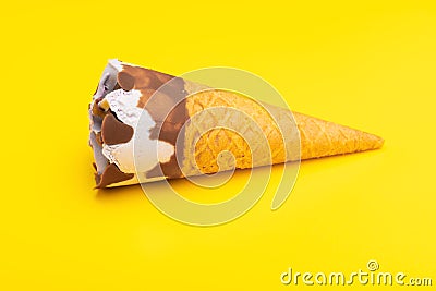 Mini Vanilla flavor ice cream cone on yellow Stock Photo