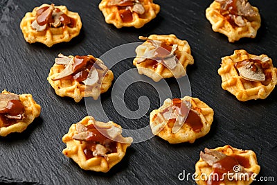 Mini waffle duck party food on rustic stone background Stock Photo