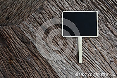 Mini wooden square chalkboard sign on wood texture background Stock Photo