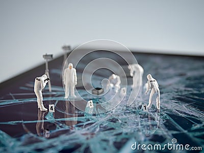 Miniatur forensic people examining broken tablet screen Stock Photo