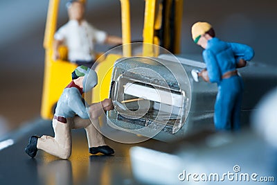 Miniature Artisans Doing Maintenance Stock Photo