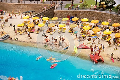 Miniature beach scene with vacationers Stock Photo