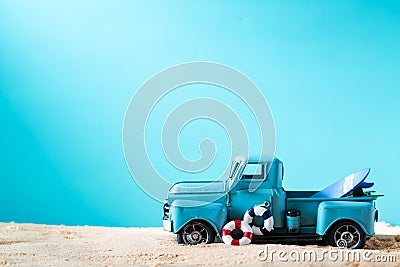 Miniature blue truck with surfboard and buoy Stock Photo