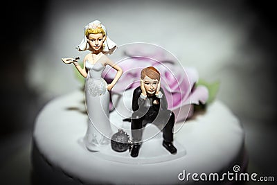 Miniature of Bride and Groom on Wedding cake Stock Photo