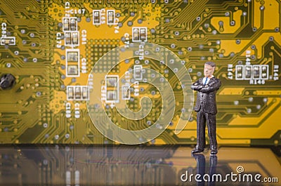 Miniature business man on modern circuit board background Stock Photo