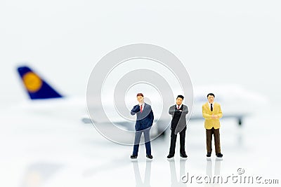 Miniature business people : businesses team with plane. Image use for background travel, business trip travel advisory agency Stock Photo