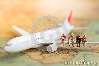 Miniature business people : businesses team waiting for airplane with copy space for travel around the world, business trip travel Stock Photo