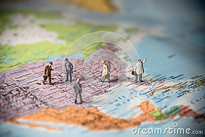 Miniature business people on top of US map. Business concept. Co Stock Photo