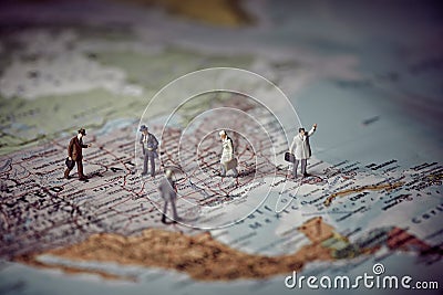 Miniature business people on top of US map. Business concept. Stock Photo