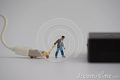 Miniature with charger plug or cable for connecting power bank Stock Photo