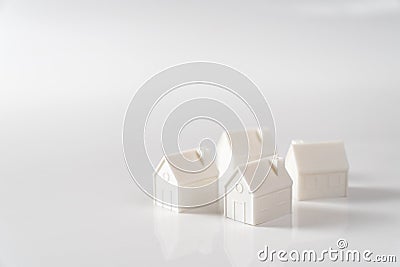 Miniature 3D printed model house on white background Stock Photo