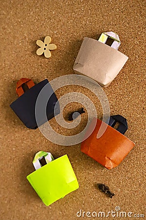 Miniature eco bags made of origami paper, shopping bags Stock Photo