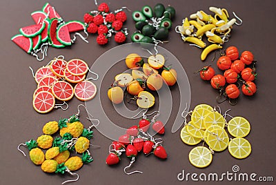 Miniature Fake Polymer Clay Fruits on Brown Background. , Polymer Clay Earrings, Plastic Summer Fruits Stock Photo