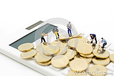 Miniature figure :Calculator for calculating money, tax, monthly/yearly. Image use for finance, business concept Stock Photo