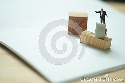 Miniature figurine of a politician speaking to the people during an election campaign to vote for him Stock Photo