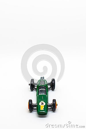 Miniature green race car with number 3 isolated on a white background Stock Photo