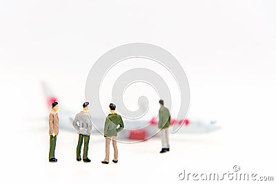 Miniature Group business walking to airplane, copy space for communication around the world. Stock Photo