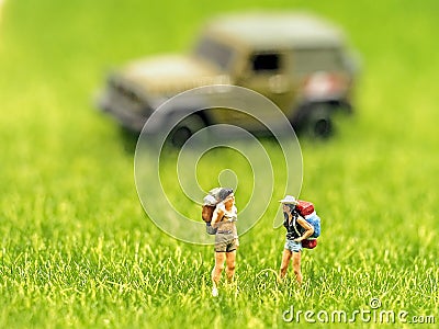 Miniature group hiker backpack traveler walking Stock Photo