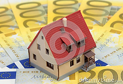 Miniature house on Euro bills Stock Photo