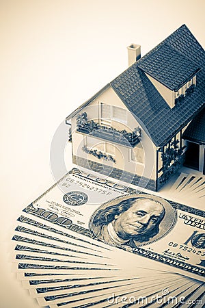 Miniature House and Money. Stock Photo