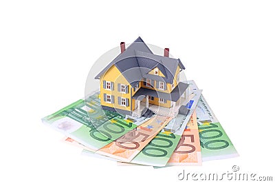 Miniature house over euro money isolated Stock Photo