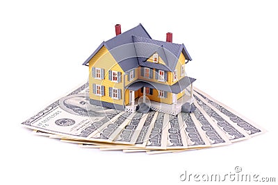 Miniature house over money isolated Stock Photo